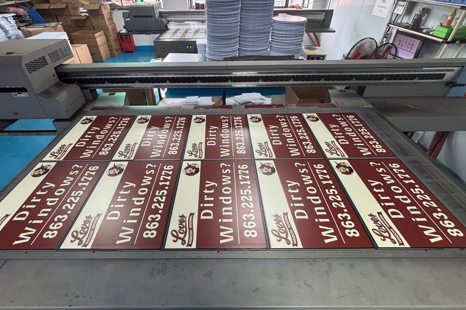 Buyer inspecting a custom corrugated plastic yard sign sample before bulk production