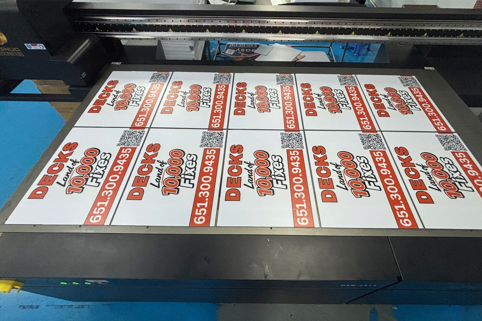UV printing machine producing full-color custom coroplast yard signs in bulk
