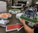 Custom-shaped corrugated plastic yard signs prepared for bulk outdoor installation