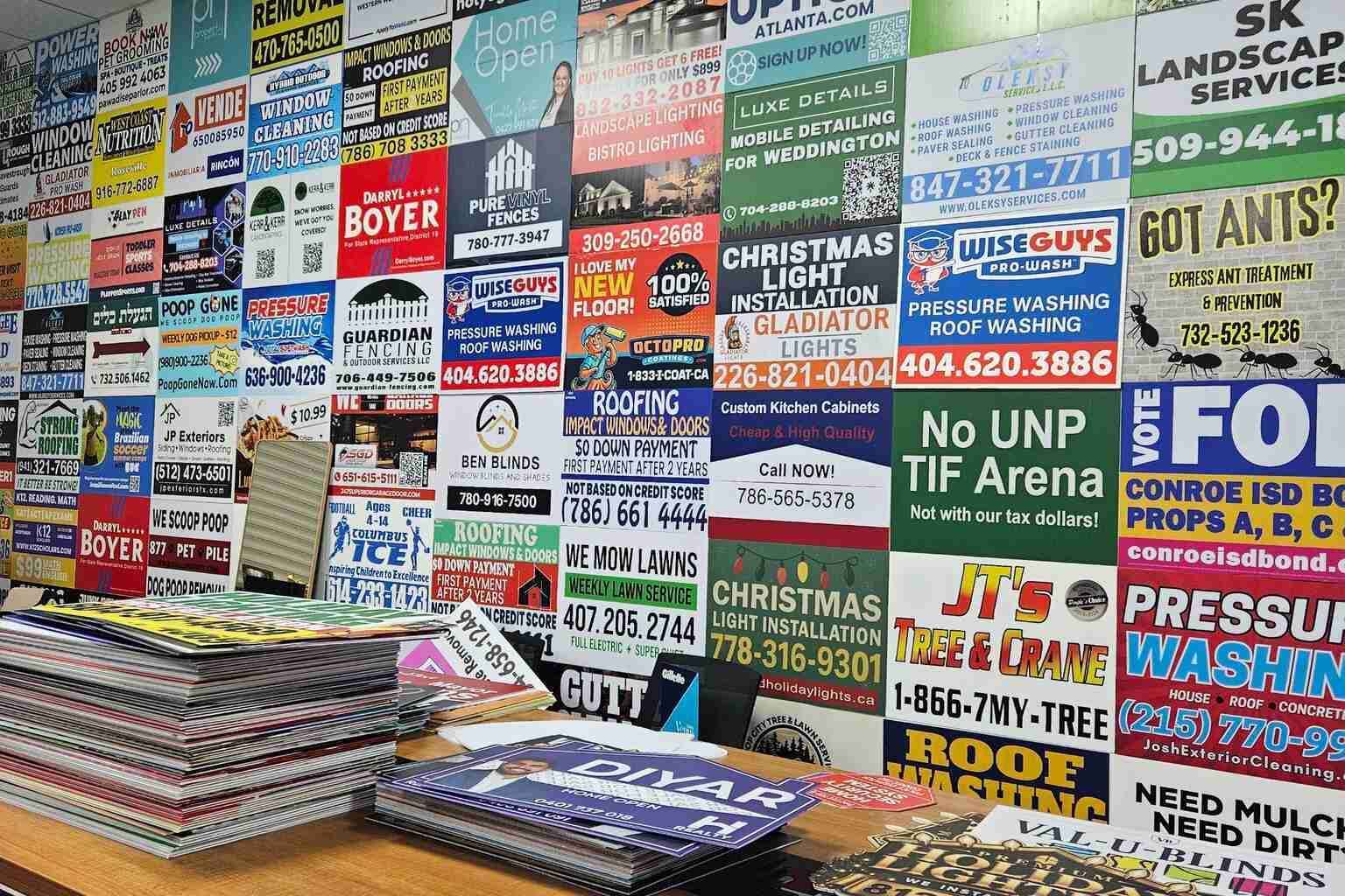 Bulk yard sign sample kit showing custom business signs in outdoor settings
