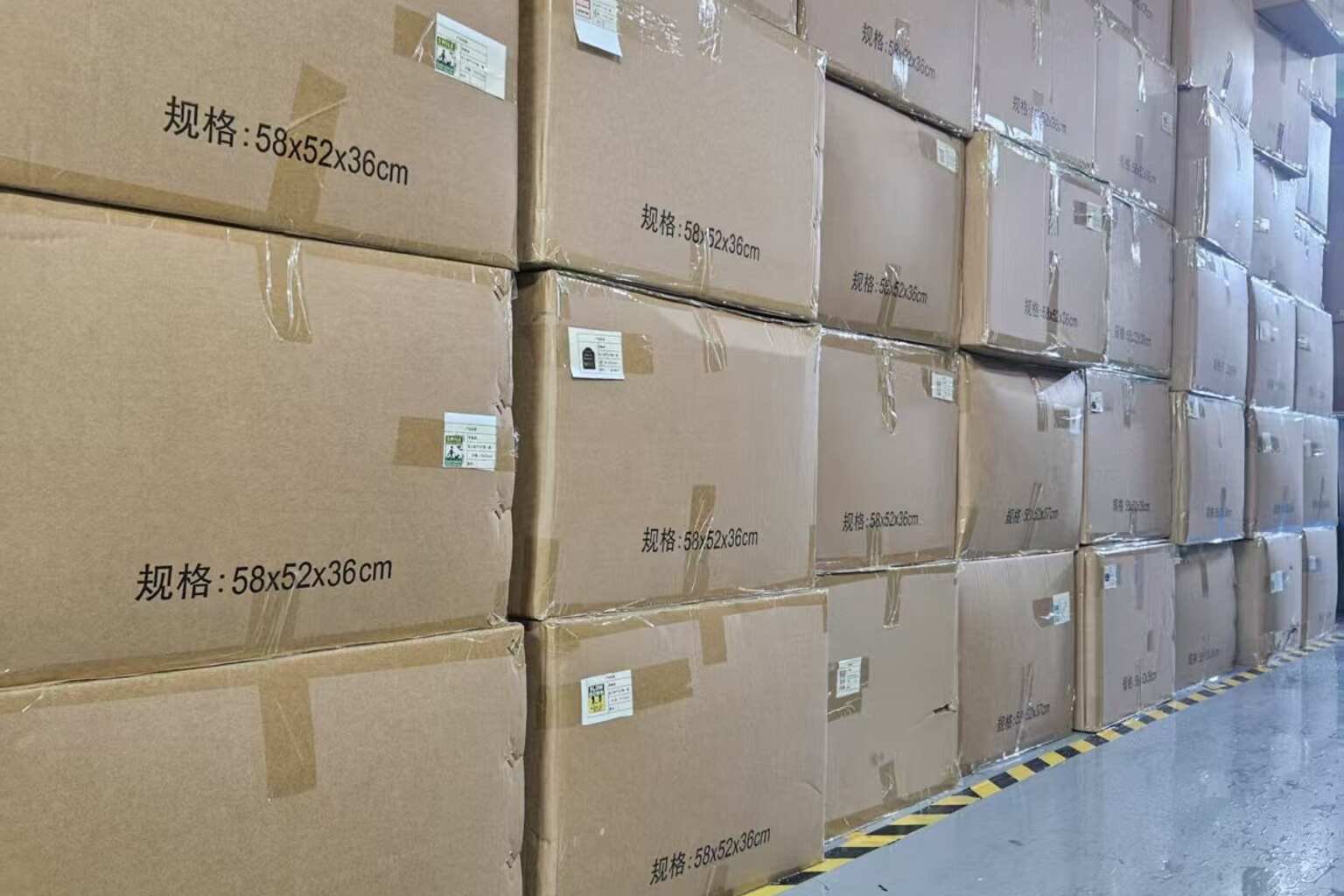 Bulk yard sign storage with labeled cartons organized inside the iYardSign warehouse